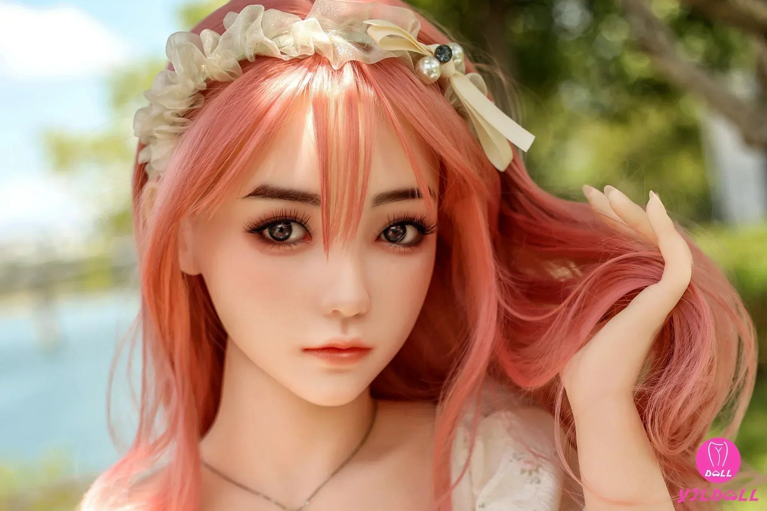YJLFS series silicone headsculpt being hand-painted by a master artist at YJL Doll factory — lifelike makeup application on premium medical-grade silicone